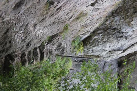 Small stone paths alongside a rocky cliff Stock Photos
