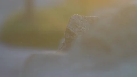 Small stone rock in sunset light Stock Footage 144536585