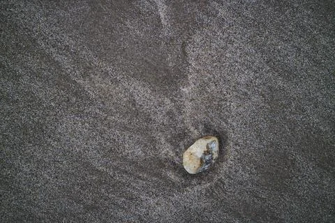 A small stone in the sand Stock Photos