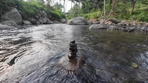 Small Stone Stack in Calm River Stream with Forest Rocks 4K Stock Footage 337060704