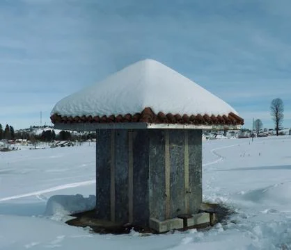 Small Stone Structure Covered with Snow in Rural Winter Landscape 9863 Stock Photos