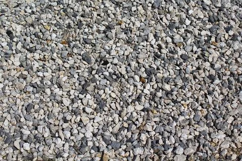 Small stone texture for background. Gray gravel stones for the construction i Stock Photos