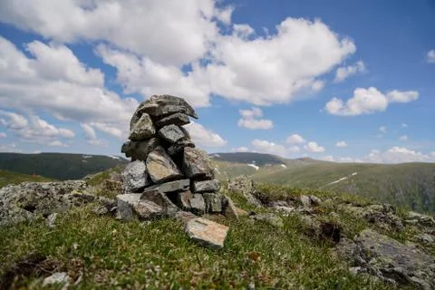 A small stone tower in mountains Stock Photos