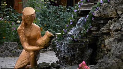 A small stone waterfall on the patio in Eastern style. Stock Footage 124770655