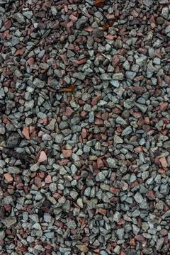 Small stones on the ground texture background Stock Photos