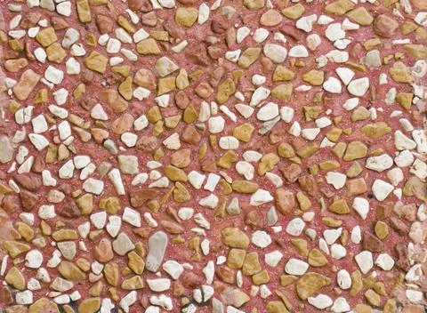 Small stones tile pattern in red concrete Stock Photos