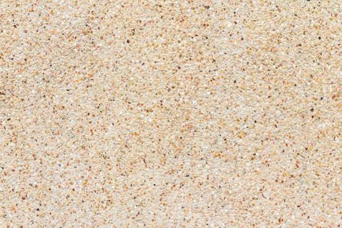 Small stones wall or Pebbles and sand wall texture background Stock Photos
