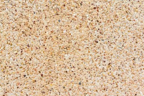 Small stones wall or Pebbles and sand wall texture background Stock Photos