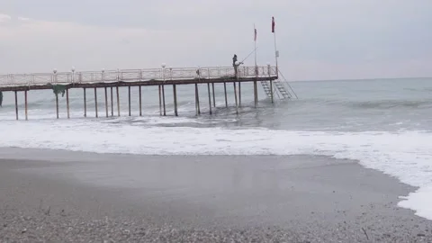 A small storm at sea at the pier Stock Footage 231677404
