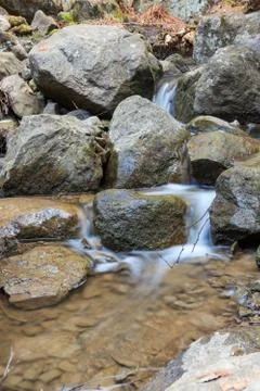 Small stream and rocks Stock Photos