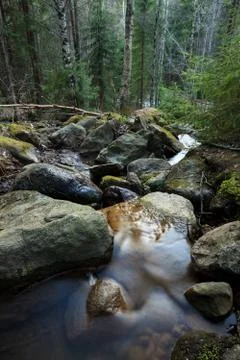 Small stream and rocks Stock Photos