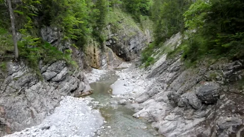 Small stream in a canyon in the bavarian alps, Aerial drone shot in 4k, gorge Video stock 168635682