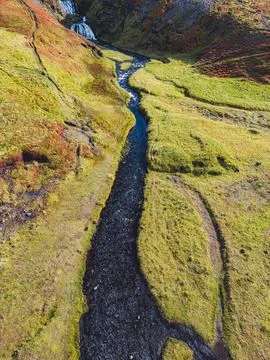 Small stream coming down from the waterfall - Iceland Stock Photos