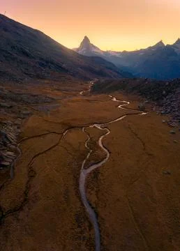 A small stream on the edge of a mountain during sunset in Zermatt.Matterhor.. 写真素材