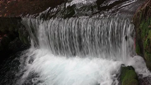 Small stream of falling water Stock Footage 213071465
