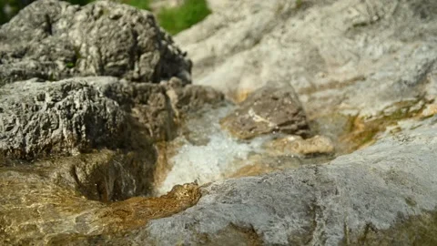A small stream is flowing over beautiful rocks in summer. Stock-Footage 211513532