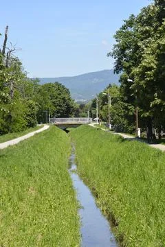 Small Stream with Footpaths and Bridge in Zagreb Stock Photos