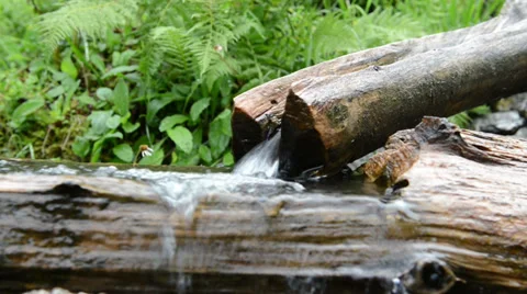 Small stream with potions made of wood Stockbeeldmateriaal 34350187