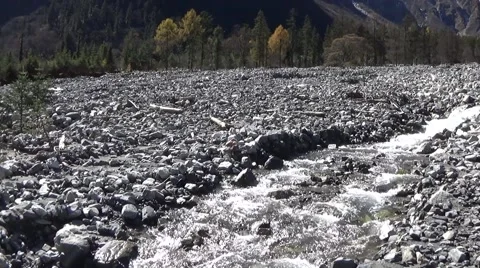 Small stream in rock area caused by mudslides Stock Footage 43372993