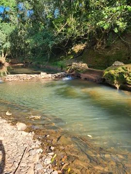 A small stream surrounded by rocks in the interior of southern Brazil Stock Photos