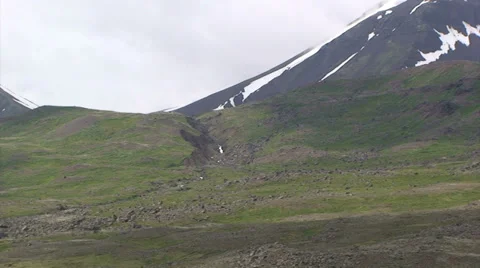 Small stream through moraine sediments at glacial valley Stock Footage 37320267