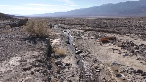 Small Stream Trickle Flow of Water in California Desert Landscape Stock Footage 134471683