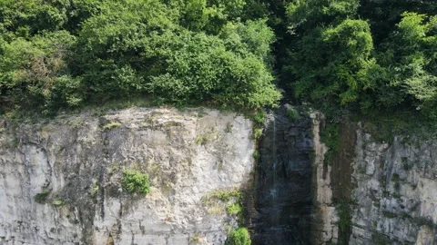 Small stream waterfall from the mountain. Drought and climate changes in nature Stock Footage 163670397