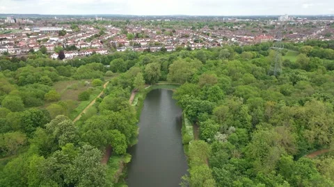 Small stream in the woods with footpaths during summertime in uk,london bire Stock Footage 155503892