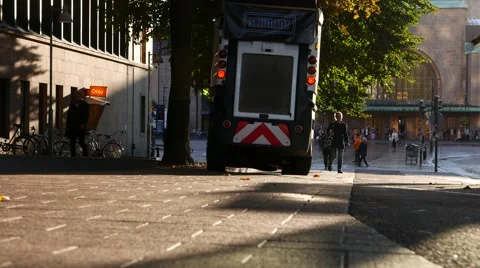 Small street sweeper ride along pavement, morning time, low angle Stock Footage