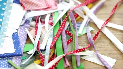 Small strips of fabric pieces lying on table, to be used in game making. Stock Footage 274710172