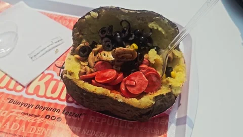 A small stuffed potato with. Stock Footage 282684636