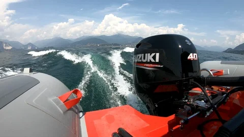 Small Suzuki outboard engine on a rib. Stock Footage 127620739