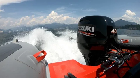 Small Suzuki outboard engine on a rib going fast. Stock Footage 127620828