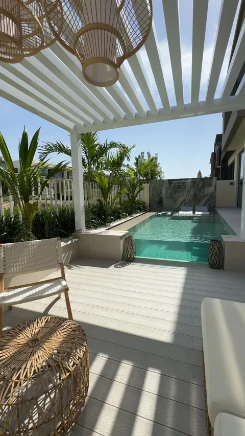 Small swimming pool with canopy and sofa in the backyard of a private villa in Stock Footage 280298269
