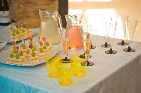 Small table with champagne and snacks 1613. Stock Photos
