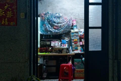 Small tailoring workshop with sewing machine and thread spools in Taipei Stock Photos