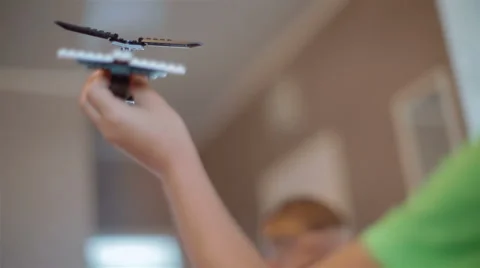 Small, talented boy playing with a toy airplane Stock Footage 40331595