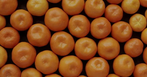 Small tangerines background. Flat lay, table spin, seamless loop. Stock Footage 277607716