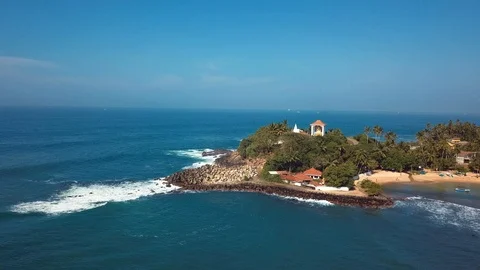 Small temple on a small rocky hill in Unawatuna near Galle Stock Footage 104993727