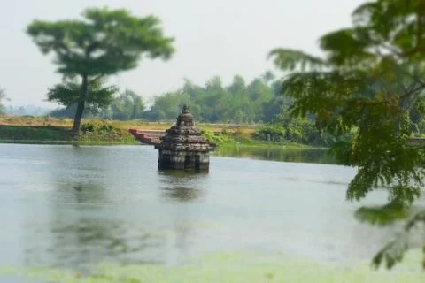 Small temple surrounded by water Stock Photos