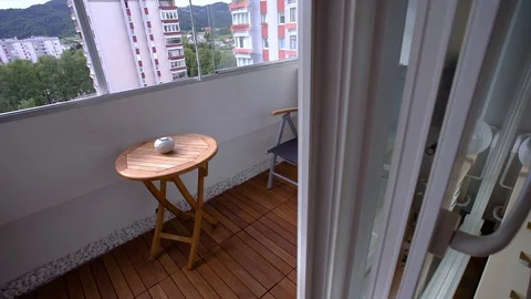A small terrace for two that rises above the city   Stock Footage 111017205