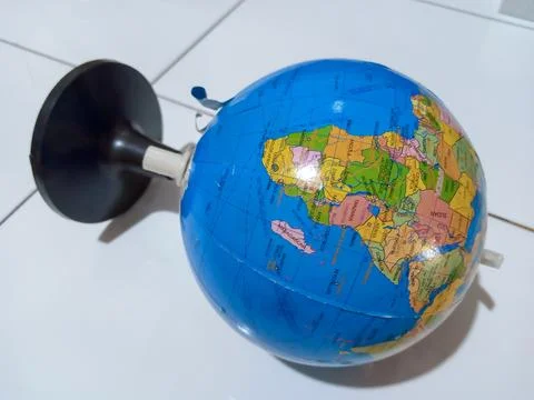 Small terrestrial globe with white background. Close Up Plastic Globe with .. Stock Photos