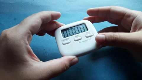 A small timer with a magnet on the back	 Stock Footage 285910920