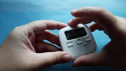 A small timer with a magnet on the back	 Stock Footage 285910921