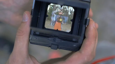 Small tiny camera screen with video of posing pretty young girl with cup of tea Video stock 116249499