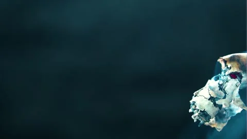 Small tiny piece of cigarette ending on the edge of the frame little bit Video stock 253139284