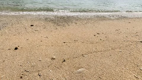 Small tiny waves lapped at the shore. Kondang Merak Beach in Malang Indonesia Stock Photos