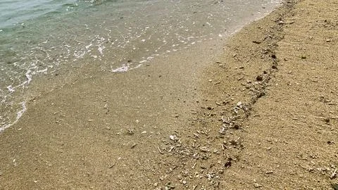 Small tiny waves lapped at the shore. Kondang Merak Beach in Malang Indonesia Stock Photos