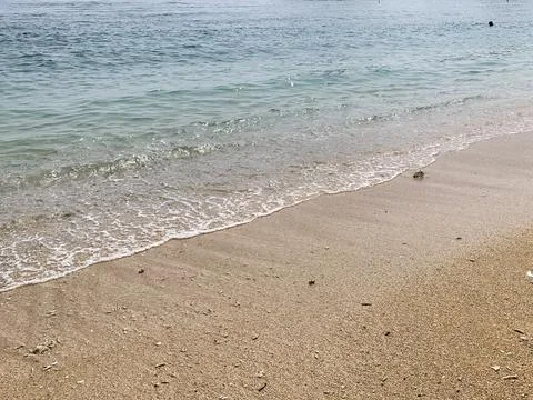 Small tiny waves lapped at the shore. Kondang Merak Beach in Malang Indonesia Stock Photos
