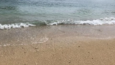 Small tiny waves lapped at the shore. Kondang Merak Beach in Malang Indonesia Stock Photos
